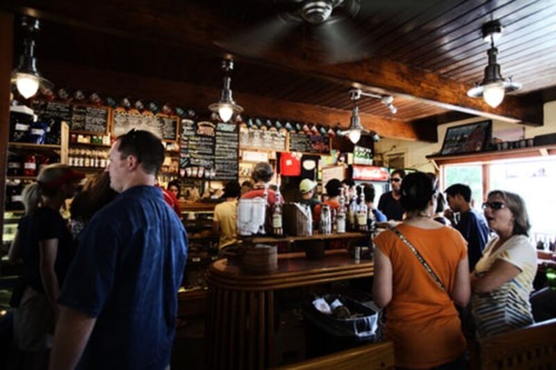 People in front of a cafe counter