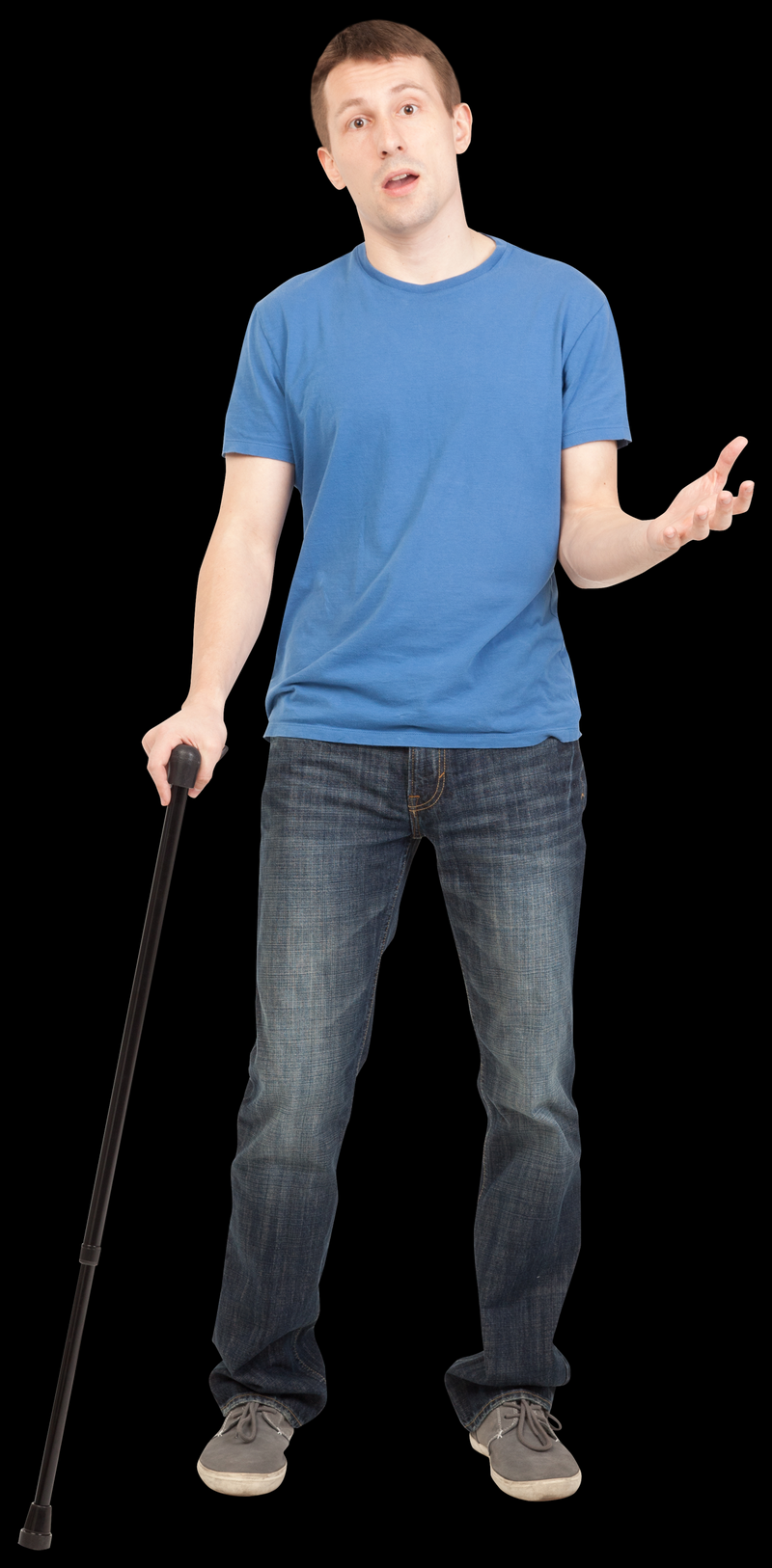 man wearing a blue T-shirt and blue jeans standing with a cane in one hand, his other arm is bent at the elbow and reaching out with that hand, with a somewhat surprised look on his face.