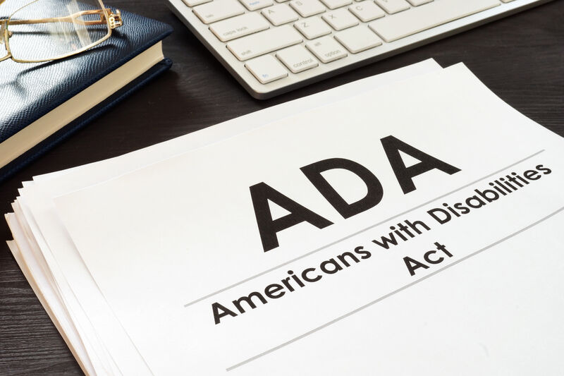 Paper on desk that reads ADA Americans with Disabilities Act